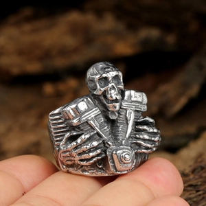 Macro detail of retro skull motor engine ring with vintage silver steel finish