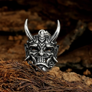 Retro stainless steel oni demon pendant necklace with vintage polished finish on rustic wood
