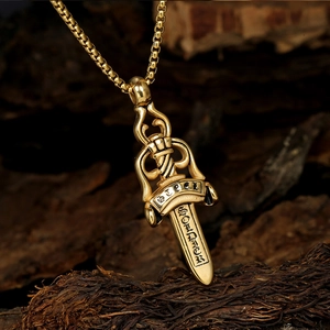 Golden double-sided sword pendant necklace with soldier engraving on wood background