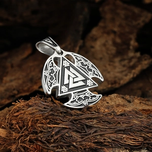 Viking Valknut triangle pendant in stainless steel on rustic wood background