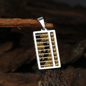Abacus pendant necklace made of stainless steel with gold beads on a branch