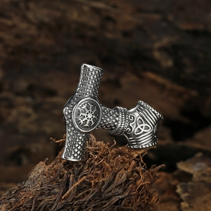 Vintage stainless steel Viking Thor's Hammer pendant with Vegvisir knotwork on aged wood