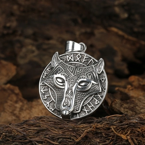 Vintage Viking wolf head rune amulet pendant in stainless steel on dark wood