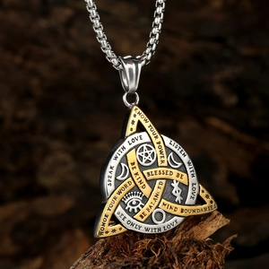 Viking Celtic Triquetra pendant necklace in two-tone stainless steel on rustic bark texture