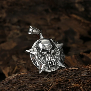 Gothic skull pendant in vintage stainless steel with star-shaped disc on wood base
