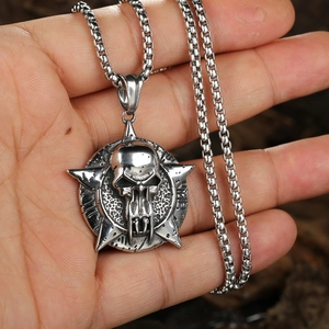 Punk style stainless steel skull star pendant necklace held by hand for male fashion