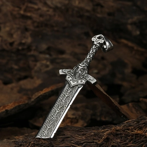 Nordic Viking sword amulet pendant in vintage silver steel set against rustic bark wood