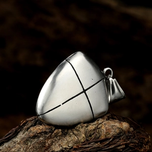 Retro punk titanium steel cross shield pendant displayed on a natural wood surface
