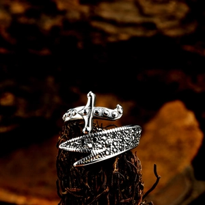 Macro shot of retro steel sword ring with textured band and oxidized silver finish