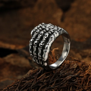 Vintage punk rock skeletal hand ring in antique silver finish with gothic skull details