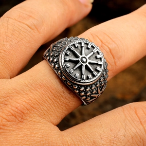 Macro shot of Viking compass totem ring in stainless steel with detailed embossed texture