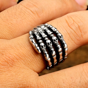 Gothic skull hand ring in retro silver punk style featuring detailed skeletal finger bones
