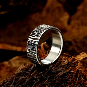 Polished silver titanium steel ring with unique textured bark pattern for men and women