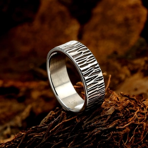 Retro stainless steel ring with rustic bark texture finish and polished inner band