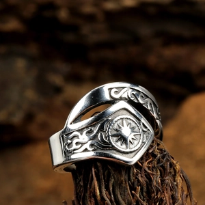 Vintage stainless steel sun god ring for men with an oxidized finish and sunburst carving