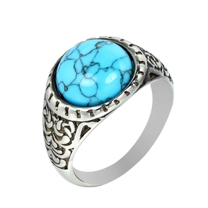 Bague punk vintage en argent avec une grande turquoise ovale et des gravures florales
