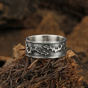 Gothic style thorn textured wide ring in vintage silver finish on rustic wooden base