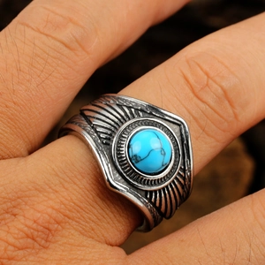 Bague vintage double plume en acier inoxydable avec pierre turquoise au doigt