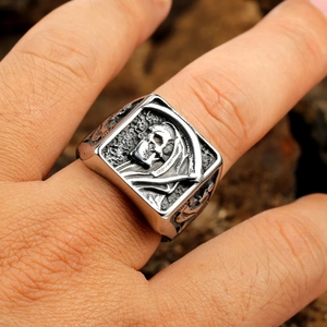 Retro stainless steel grim reaper ring with scythe and skull detail worn on finger