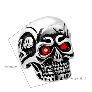 Punk style titanium steel skull ring with red eye stones and engraved details