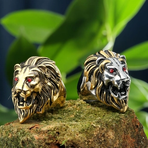 Bold vintage lion head rings in gold and silver finish with red stone eyes on stone