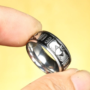 Punk style Claddagh ring in black titanium steel with hands holding a crowned heart