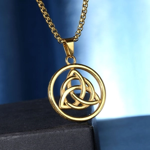 Close-up of golden stainless steel Celtic Knot pendant with matching round box chain necklace
