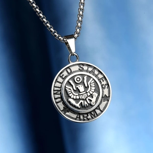 Macro shot of silver embossed United States Army eagle emblem on a round pendant
