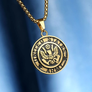 Macro detail of gold stainless steel United States Army eagle coin pendant on blue satin