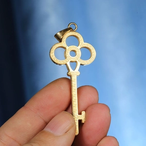 Elegant gold plated key pendant necklace featuring intricate Greek Key patterns for women