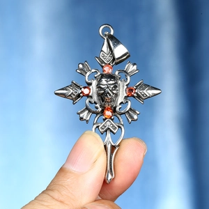 Gothic skull cross necklace with orange gemstones and vintage silver finish