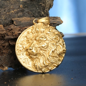 Vintage gold lion head pendant in embossed round stainless steel design for men
