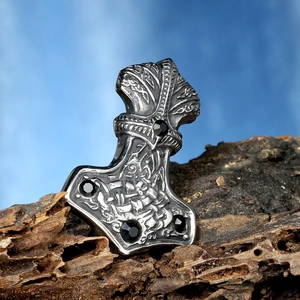 Retro stainless steel Thor Hammer pendant necklace with black stones on rustic wood