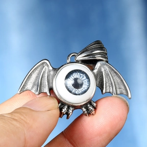 Vintage gothic bat wings and claw pendant necklace featuring a realistic blue eyeball