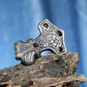 Vintage Mjölnir pendant with black gemstones and Viking knots on natural bark