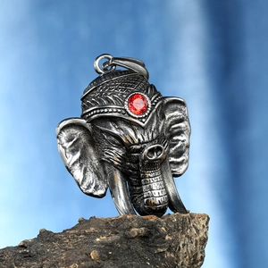 Detailed view of Ganesh elephant pendant with red gem inlay and vintage silver finish