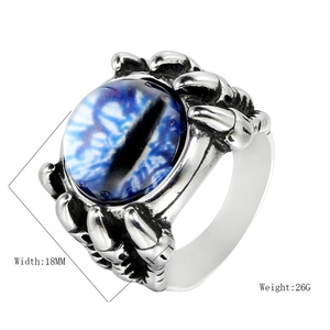 Macro shot of punk dragon claw ring with blue evil eye detail and 18mm width specs