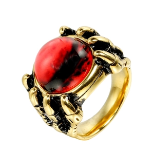 Punk titanium steel dragon claw ring with red mystical eye stone on a white background