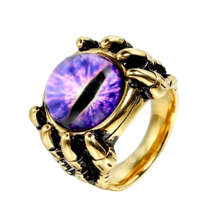 Gothic punk dragon claw ring in vintage gold with a purple evil eye gemstone