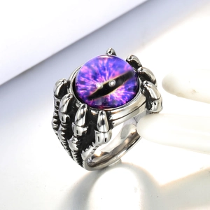 Macro view of purple dragon eye ring with stainless steel eagle claw setting detail