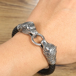 Men's braided leather bracelet featuring vintage silver tiger head metal magnetic clasp
