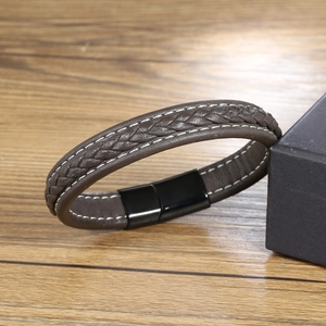 Brown woven leather bracelet with contrast stitching and black magnetic metal clasp