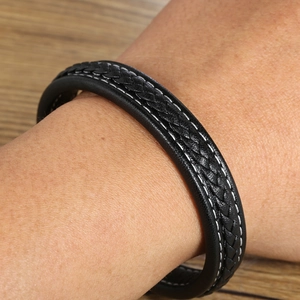 Braided black leather bracelet for men with white stitching and magnetic clasp