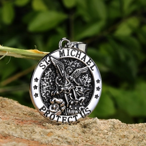 Saint Michael protector medallion necklace in vintage silver steel on natural stone background