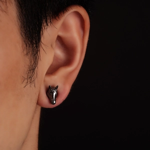 Creative horse head stud earrings in gun black finish worn on ear for men and women