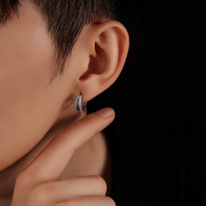 Close-up of double layer hoop earrings featuring blue turquoise and white cubic zirconia