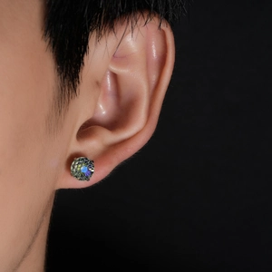 Four-prong stainless steel earring with gradient fireworks cut stone worn on ear