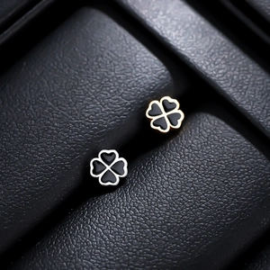 Titanium steel four leaf clover earrings in gold and silver finish with black enamel inlay