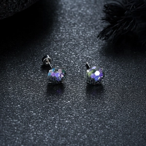 Detailed close-up of gradient firework cut crystal earrings with titanium steel studs