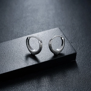 Minimalist triangle hoop earrings for men and women with triple groove texture in silver